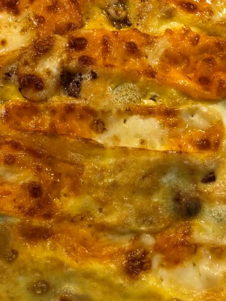 istock Close-up Omelet with cheese and ham in vertical 1281306542