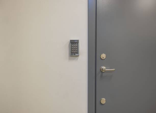 istock View of grey metal door with digital code lock. Security concept. 1281306610