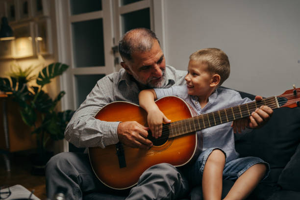 istock grandfather and grandson at home 1281308685
