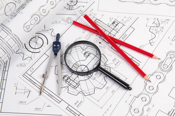 istock Industrial chain drawings, engineering compass, magnifying glass and pencils 1281310389