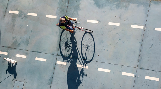 Santander, Cantabria, Spain.  September 2017. Zenithal view of a cyclist circulating through the bicycle lane of the port of Santander