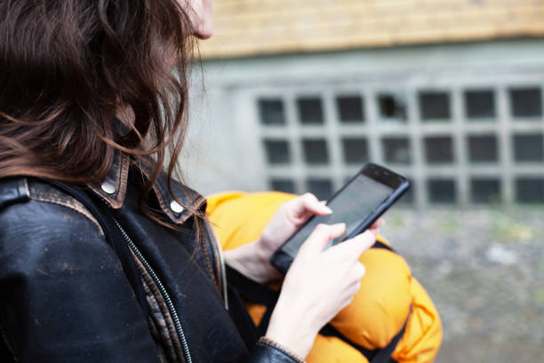 istock Young girl travels with her sleeping bag and backpack 1281315354