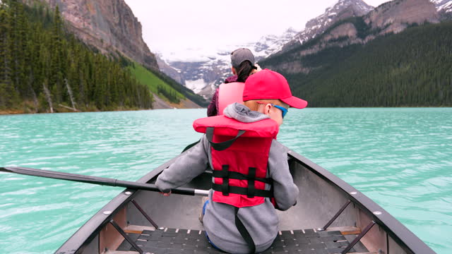 POV Family canoeing at Lake Louise, Alberta in Summer