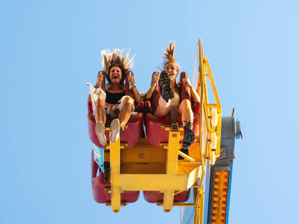 Two women at amusement park. Two excited women at Fabbri Booster attraction amusement park photos stock pictures, royalty-free photos & images