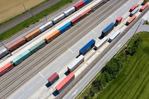 Large group of cargo containers and freight trains, aerial view, Germany, Europe.