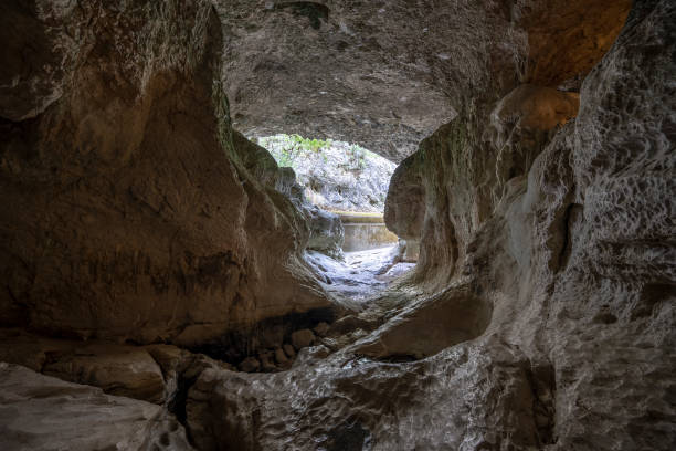 istock cavernous rock formations belonging to the source of the river Alviela 1281318458