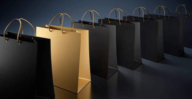 golden shopping bag with black shopping bags - sacos de presente imagens e fotografias de stock