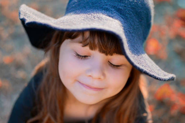 istock Little girl in halloween witch costume 1281321919