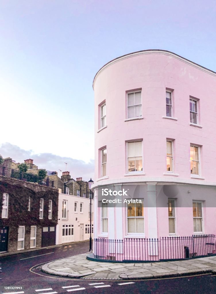 Colourful houses of Notting Hill Warm and pastel colours of houses in Notting Hill are a true gem of London. Cozy architectural style of buildings has become an attraction for tourists and film-makers. Notting Hill Stock Photo