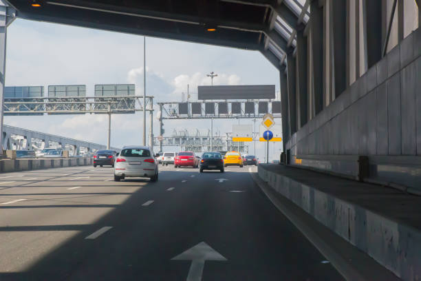 istock Cars leaving tunnel in downtown 1281323078