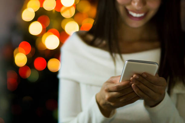 istock Woman texting on Christmas Day 1281323440