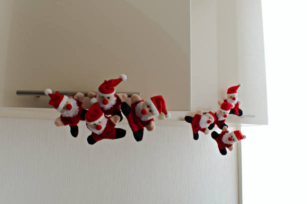 istock funny santa claus toys have opened kitchen cabinet 1281323613