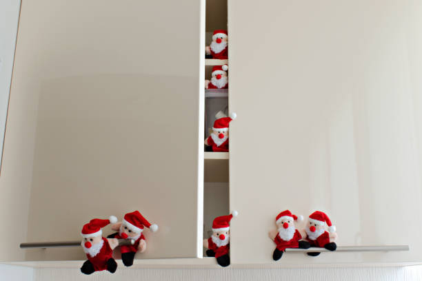 istock funny santa claus toys have opened kitchen cabinet 1281323614
