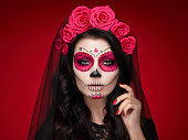 Portrait of a woman with makeup sugar skull