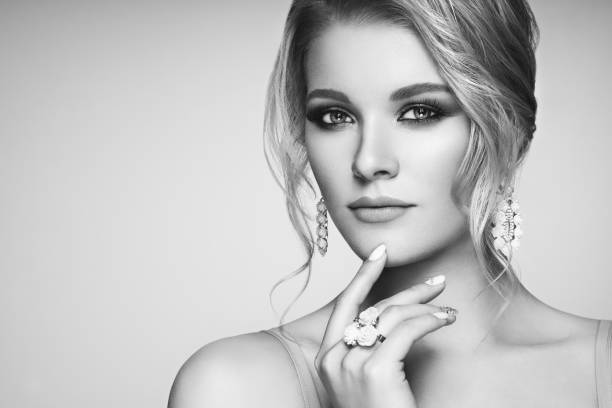 Portrait Beautiful Woman with Jewelry Portrait Beautiful Blonde Woman with Jewelry. Model Girl with Pearl Manicure on Nails. Elegant Hairstyle. Precious Stones and Silver. Beauty and Fashion Accessories. Perfect Make-Up. Black and White photo necklace photos stock pictures, royalty-free photos & images