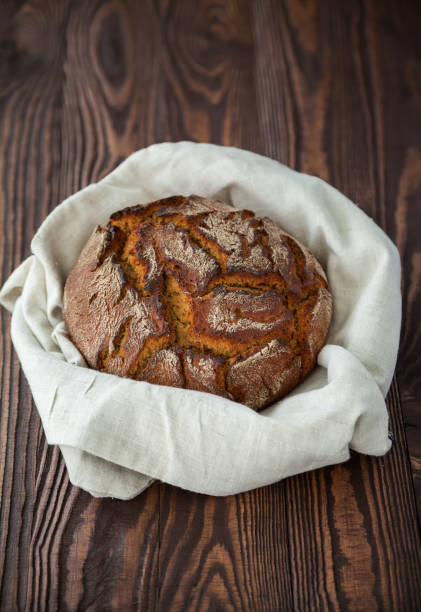 istock circle bread in a linen cloth on a wooden background 1281324982