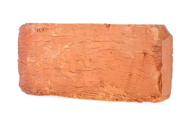 istock Closeup of old brown brick isolated on a white background 1281325738