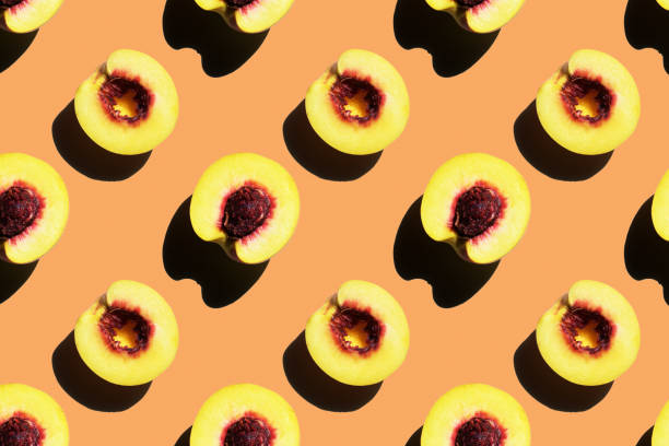 istock Seamless peach textures on an orange background. Top view 1281326158