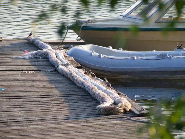 istock Two boats at a jetty 1281329311