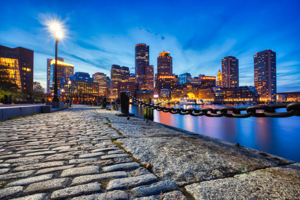 boston skyline with financial district and boston harbor at dusk, usa - boston harbor imagens e fotografias de stock