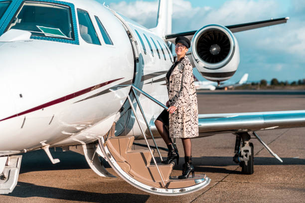 istock Beautiful woman gets on the private plane 1281332623