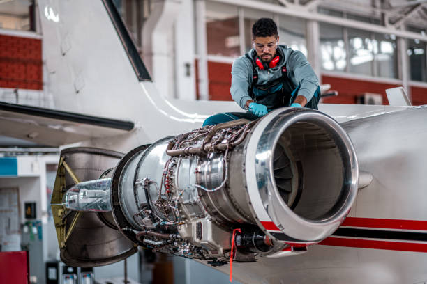istock Aircraft mechanic repairs an aircraft engine 1281334152