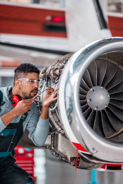 istock Aircraft Maintenance Mechanic Inspecting Jet Engine 1281334311