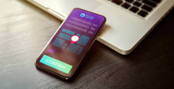 istock Delivery Service e-commerce business concept. Quick and convenient opportunity to order products, food on the quarantine to the home. Mobile phone with delivery order processes and confirmation button 1281339698
