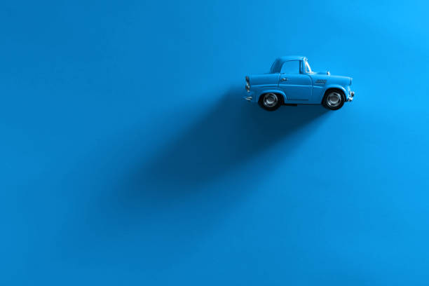 istock Blue toy car on a blue background. 1281340080