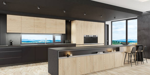 istock Luxurious matte black minimalist kitchen interior with long island table and wooden cabinets 1281340118
