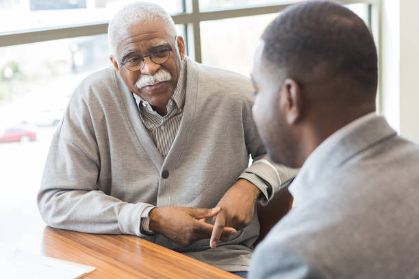 istock Senior man meets with financial planner 1281341039