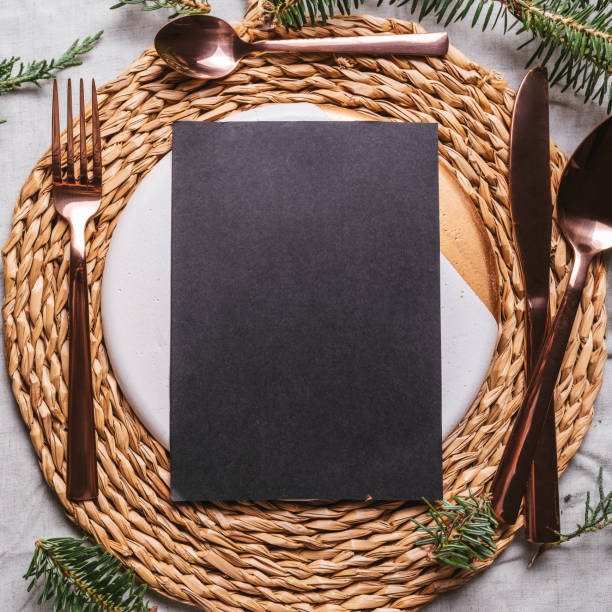 istock menu place setting with empty card and golden cutlery 1281343077