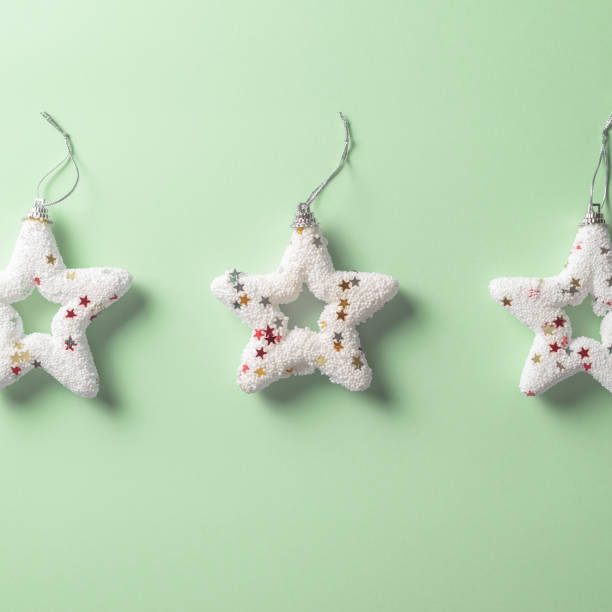 istock white Christmas star ornament on sparce green mint background 1281348866