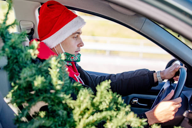 istock Young Man Returning From Christmas Tree Shopping 1281350062