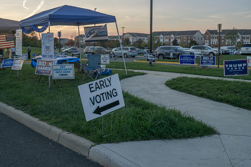 South Riding, Virginia, October 20, 2020: Early voting in Virginia for the 2020 presidential election at the South Riding voting station with voters, campaign staff and campaign signs for both Biden and Trump.