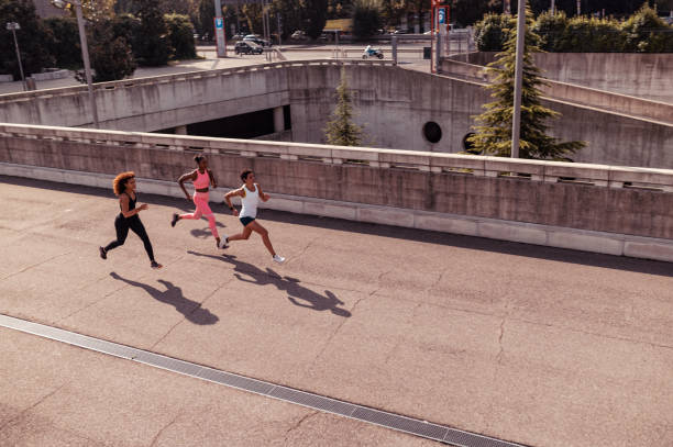 istock Three sporty women running 1281351753