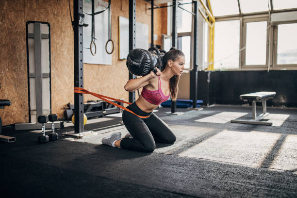 istock Young sportswoman working out with gym bag 1281352822