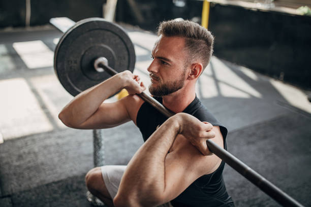 istock Fit man working out with weights in the gym 1281352883
