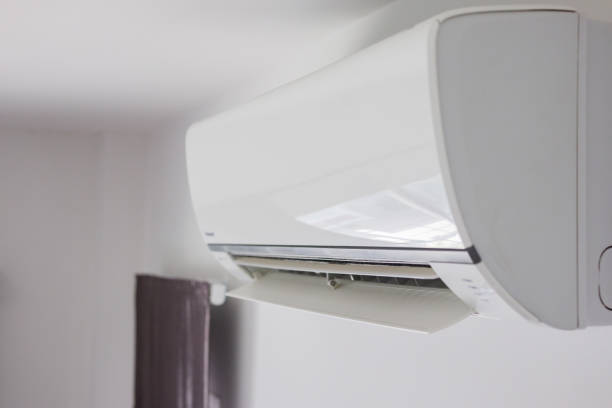 istock Air conditioner on white wall room interior background 1281355585