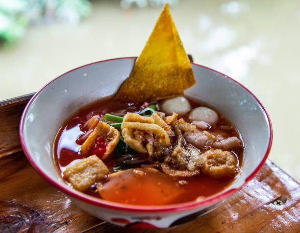 istock Yentafo Thai noodle with pink soup in bowl. 1281356835