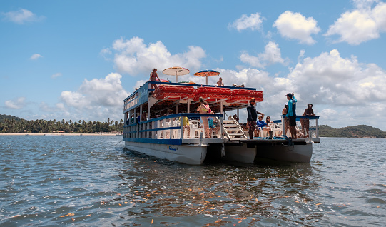 Tamandaré district, Pernambuco state, Brazil - October 17, 2020:Brazilian tourists visiting Carneiros beach.