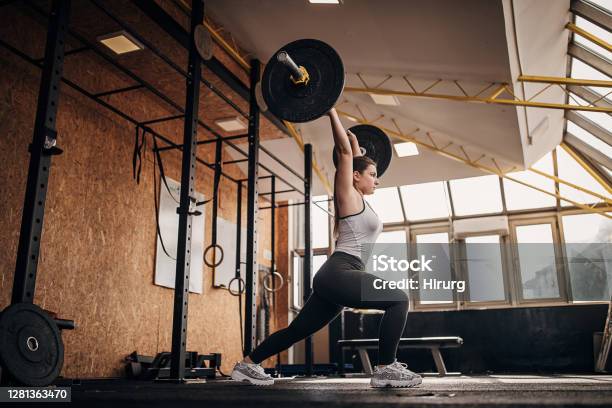 Fit Woman Training With Weights In Gym Stock Photo - Download Image Now - Weightlifting, Weight Training, Women