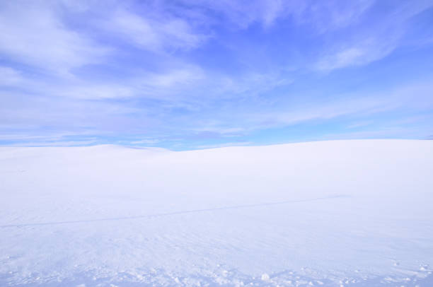 istock Snowy Countryside Under Partly Cloudy Sky 1281364225
