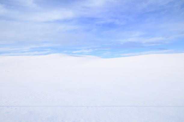 istock Snowy Countryside Under Partly Cloudy Sky 1281364254