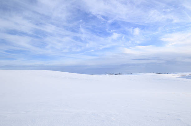 istock Snowy Countryside Under Partly Cloudy Sky 1281364261