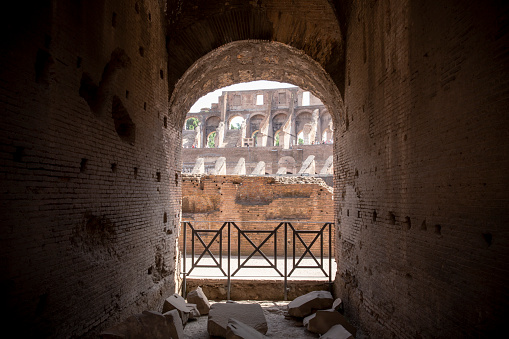 Looking through a interior doorway inside the Roman Colosseum on a Sunny Day.