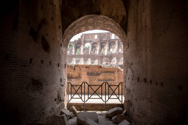 Inside the Roman Colosseum Looking through a interior doorway inside the Roman Colosseum on a Sunny Day. inside the colosseum stock pictures, royalty-free photos & images