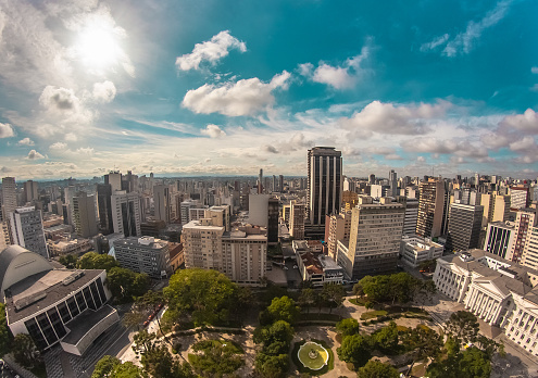 Wide-angle aerial view of urbanized center with colorful skyscrapers in the morning - Praça Santos Andrade - Curitiba, capital of the State of Paraná, Brazil
