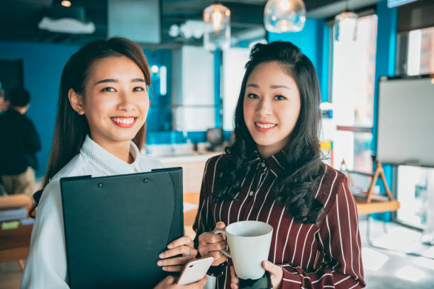 istock Two casual business people 1281367130