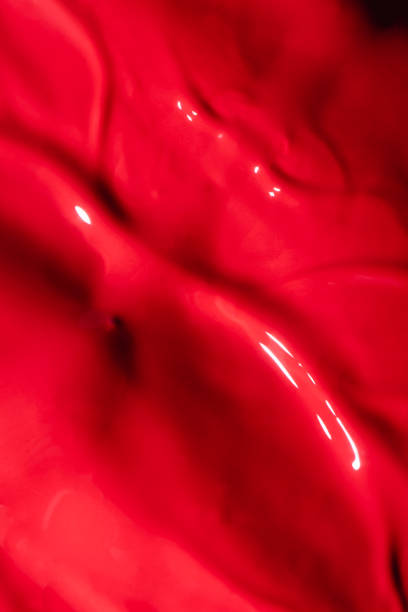 istock close up view of red liquid lipstick texture 1281368093